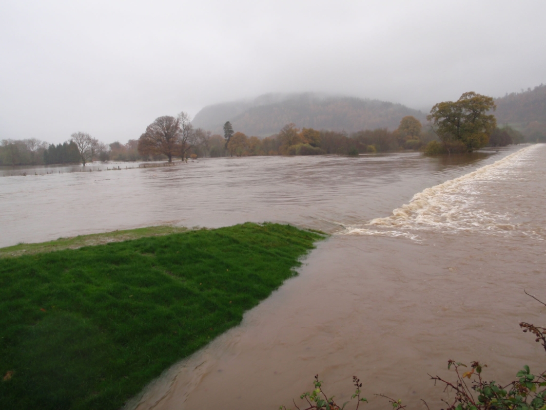 Shear Stress Turf Spillway Overtopping