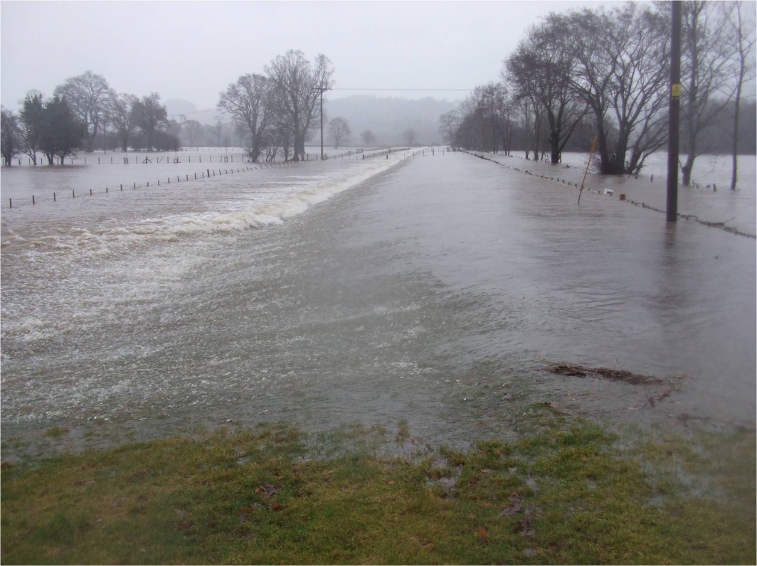 Shear Stress Turf Spillway Overtopping