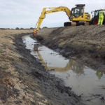 Placing translocated vegetation in the new channels