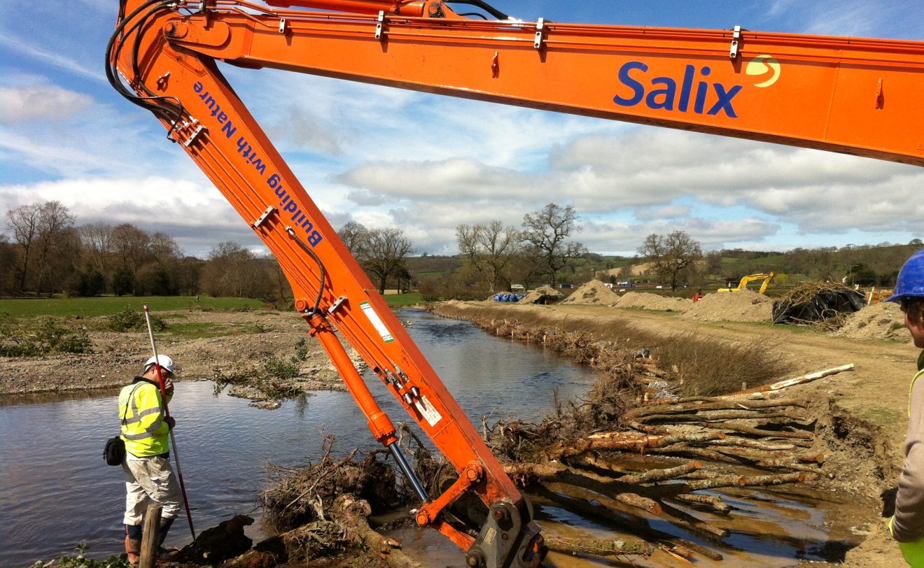 Live willow revetments being installed using a long reach