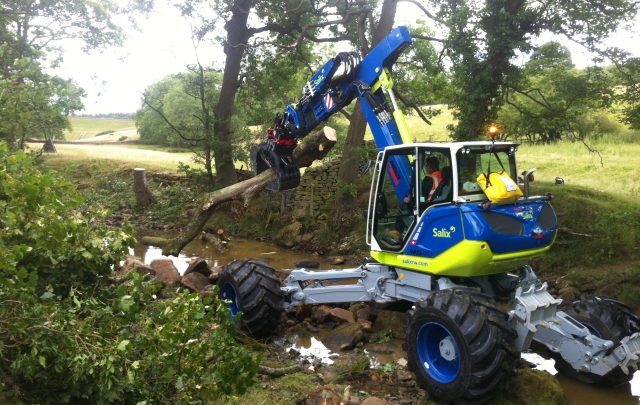 Spider Menzi Muck Excavator moving large woody debris below Swinsty Reservoir