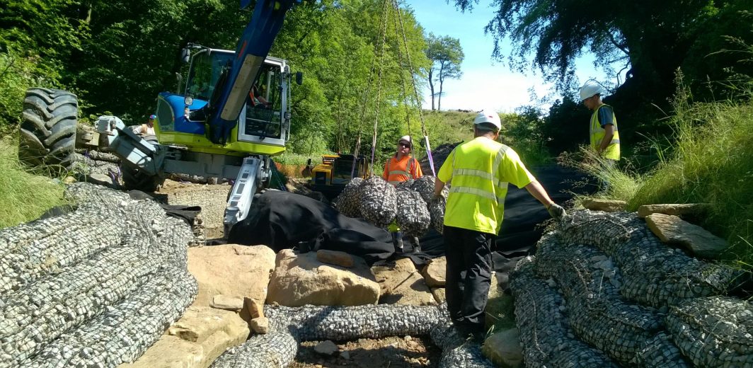 Jacks Keys laying Rock Mattresses in river bed using our Spider Menzi Muck