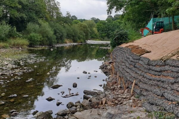 pre-filled-rock-rolls-in-situ-on-river-bank